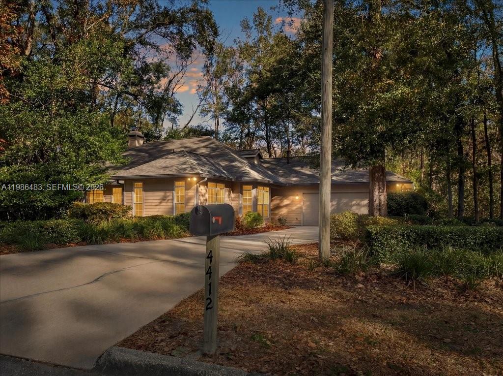4412 Southwest 101 Drive Gainesville, FL 32608 - Photo 23 of 52 a view of a street in front of house