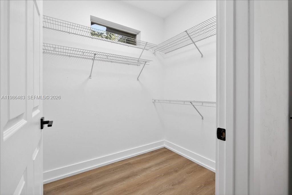 4412 Southwest 101 Drive Gainesville, FL 32608 - Photo 35 of 52 a view of a room with racks on the wall