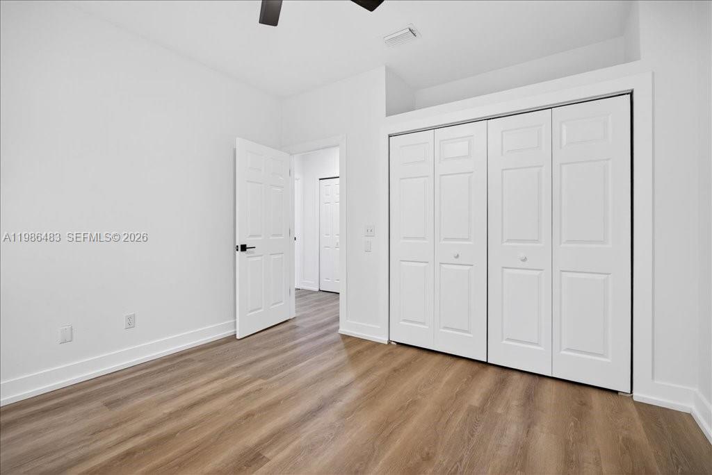 4412 Southwest 101 Drive Gainesville, FL 32608 - Photo 41 of 52 a view of an empty room with wooden floor