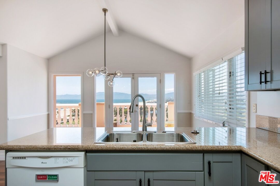 217 Fowling Street Playa del Rey, CA 90293 - Photo 19 of 51 a kitchen with counter top space and living room view