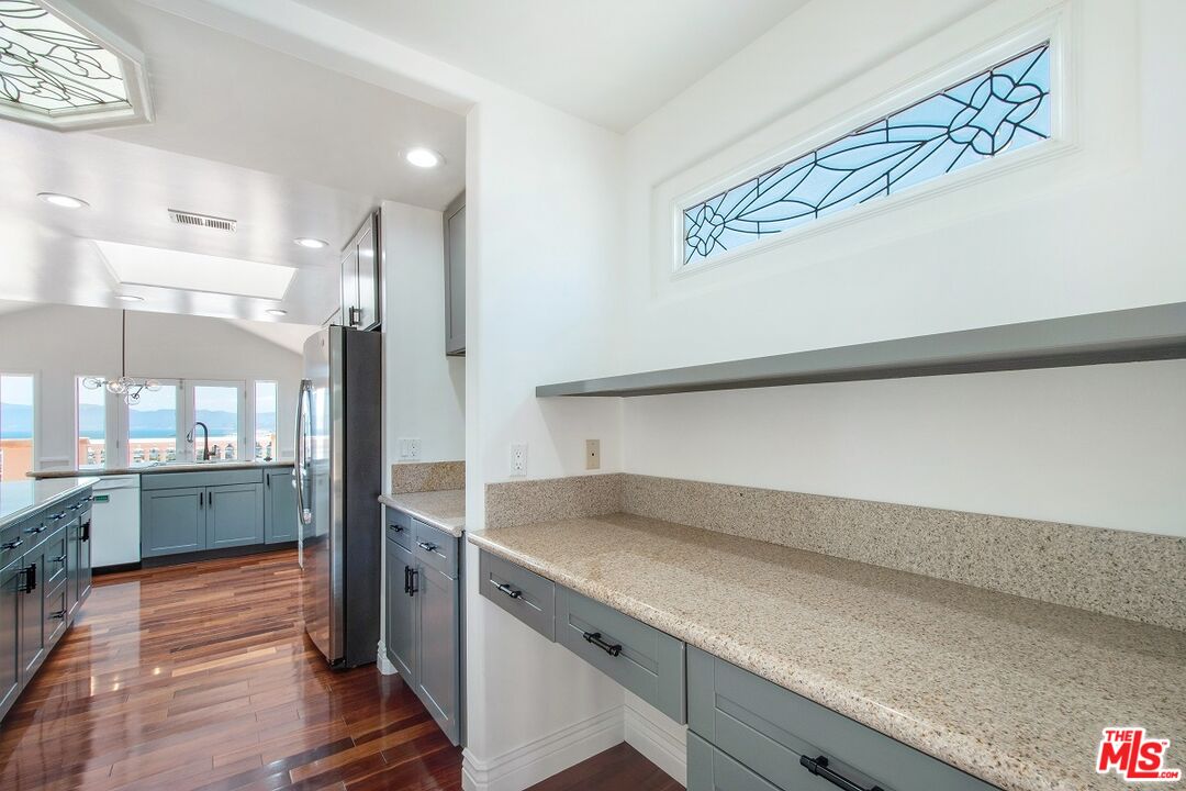 217 Fowling Street Playa del Rey, CA 90293 - Photo 22 of 51 a kitchen with a sink and wooden floor