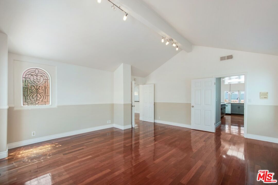 217 Fowling Street Playa del Rey, CA 90293 - Photo 23 of 51 a view of empty room with wooden floor