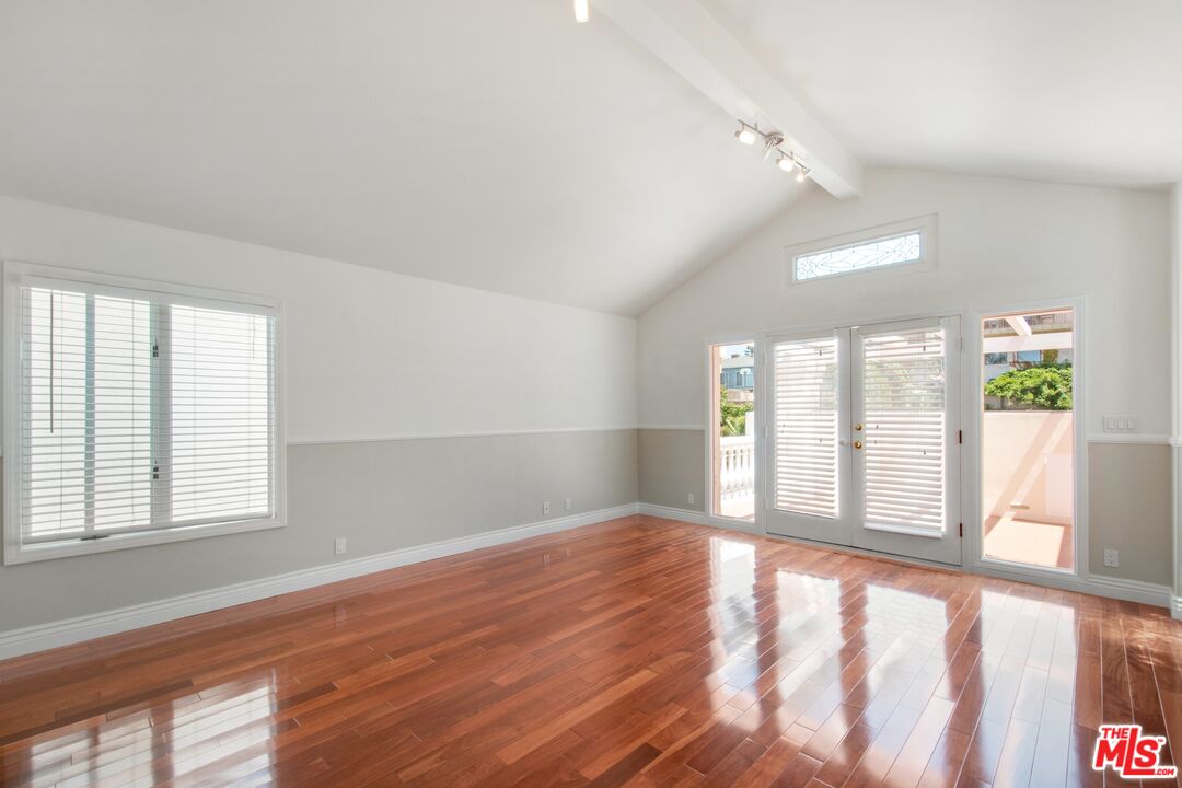 217 Fowling Street Playa del Rey, CA 90293 - Photo 25 of 51 a view of an empty room with wooden floor and a window