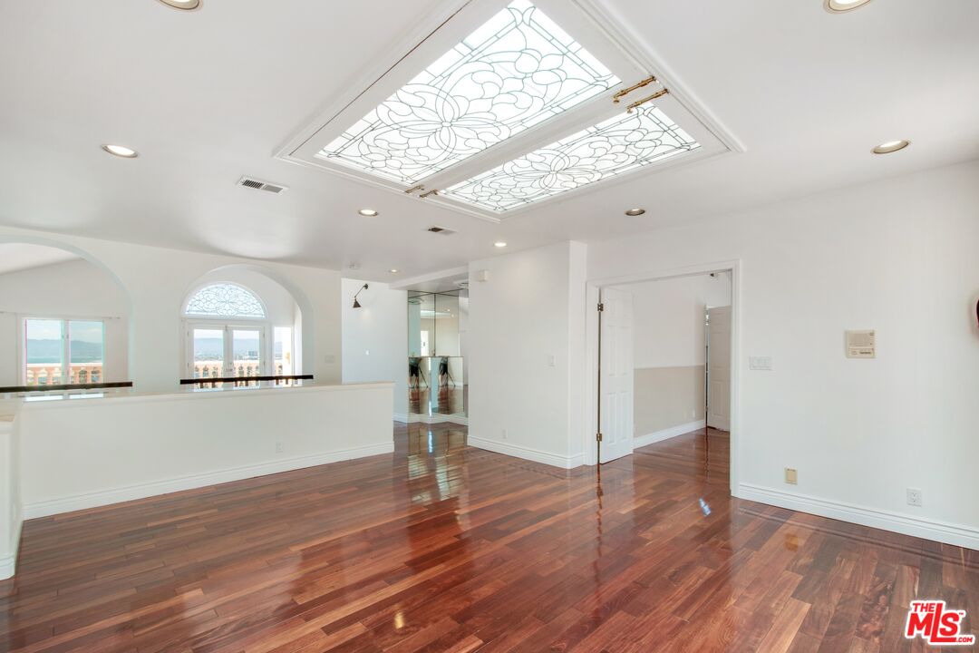 217 Fowling Street Playa del Rey, CA 90293 - Photo 28 of 51 a view of empty room with wooden floor and fan