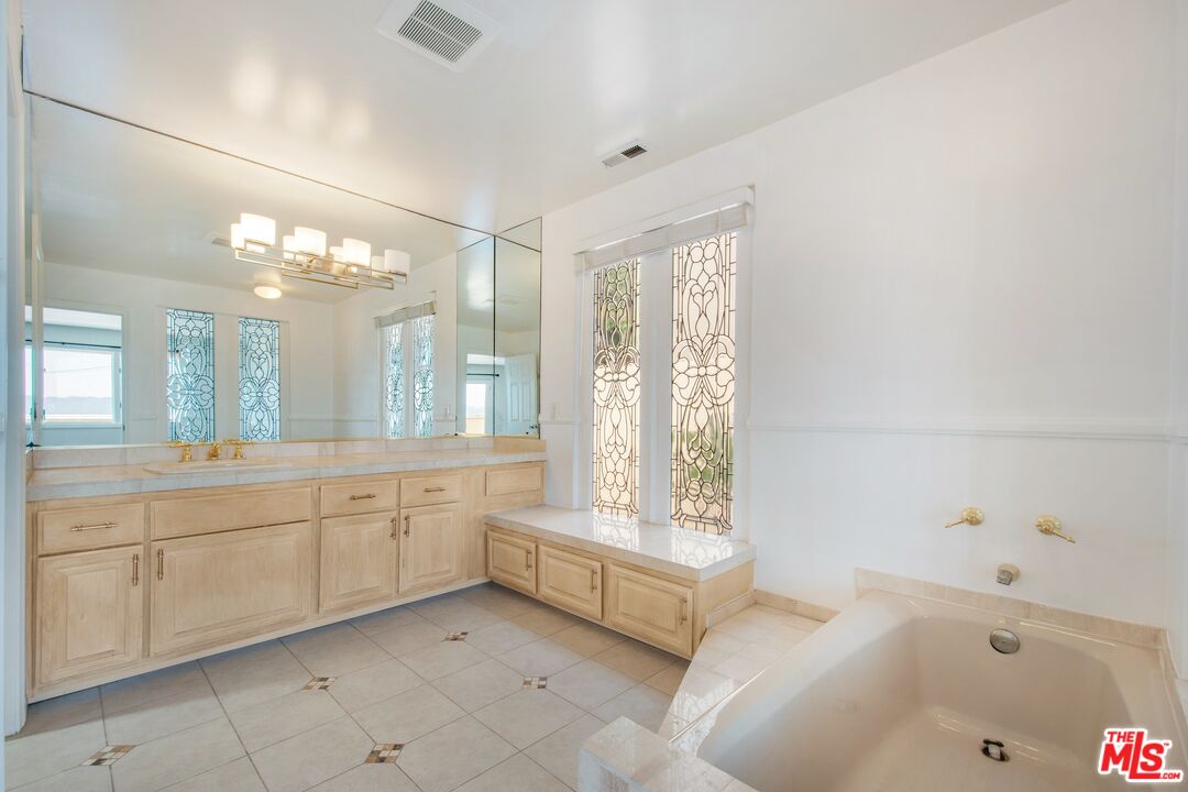 217 Fowling Street Playa del Rey, CA 90293 - Photo 33 of 51 a spacious bathroom with a tub sink and shower