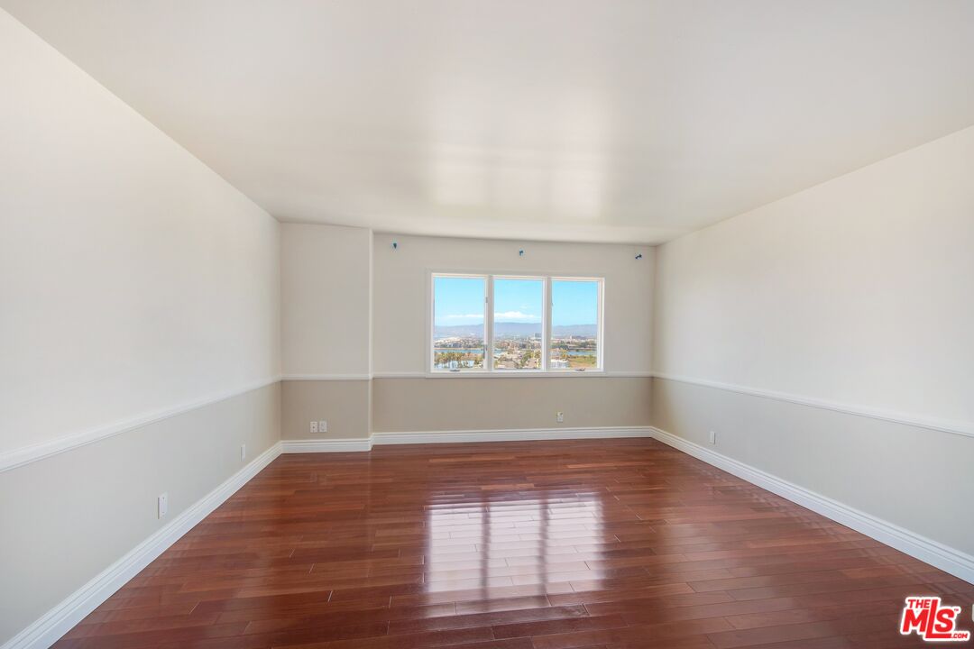 217 Fowling Street Playa del Rey, CA 90293 - Photo 35 of 51 wooden floor in an empty room with a window