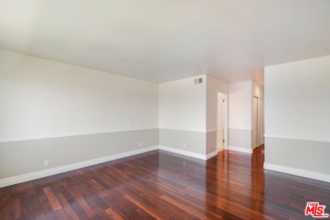 217 Fowling Street Playa del Rey, CA 90293 - Photo 36 of 51 a room that has a glass door and wooden floor