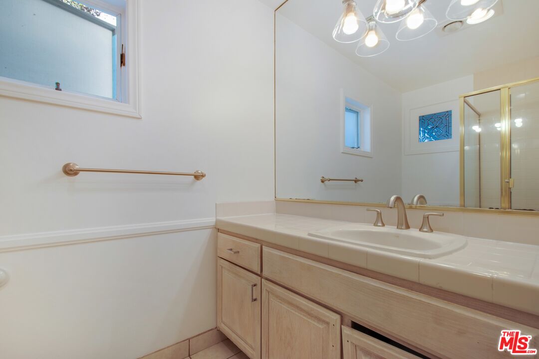 217 Fowling Street Playa del Rey, CA 90293 - Photo 41 of 51 a bathroom with a sink and a mirror