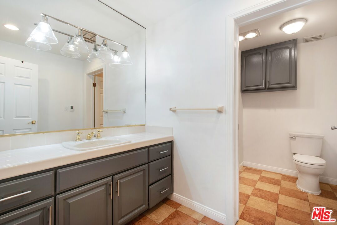 217 Fowling Street Playa del Rey, CA 90293 - Photo 47 of 51 a spacious bathroom with a sink a toilet and a mirror