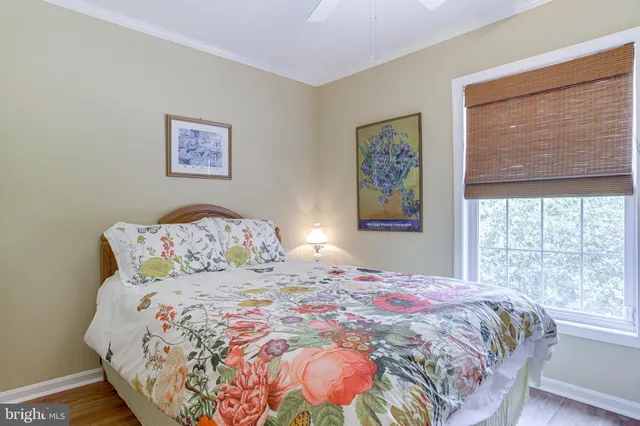 a bedroom with a bed and a lamp