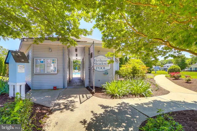a view of a swimming pool and a yard