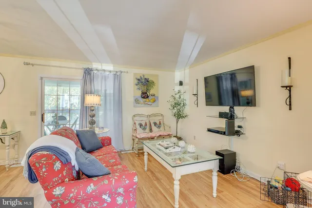 a bedroom with a bed and flat screen tv