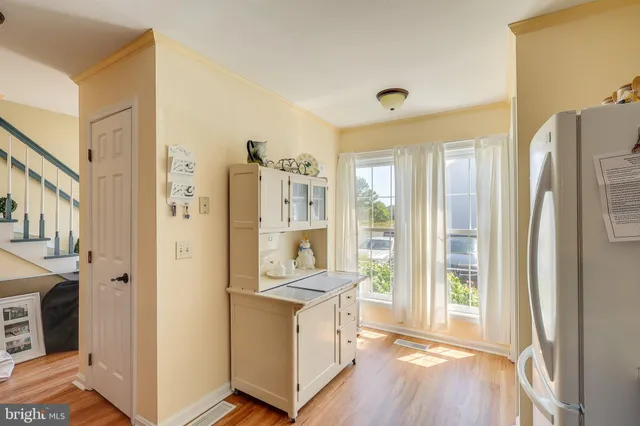a view of living room with furniture and large window