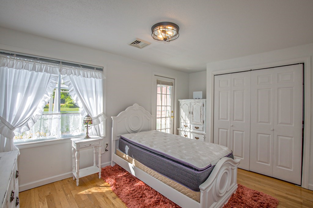 130 Cottage Road Enfield, CT 06082 - Photo 11 of 33 a living room with a bed furniture and a window