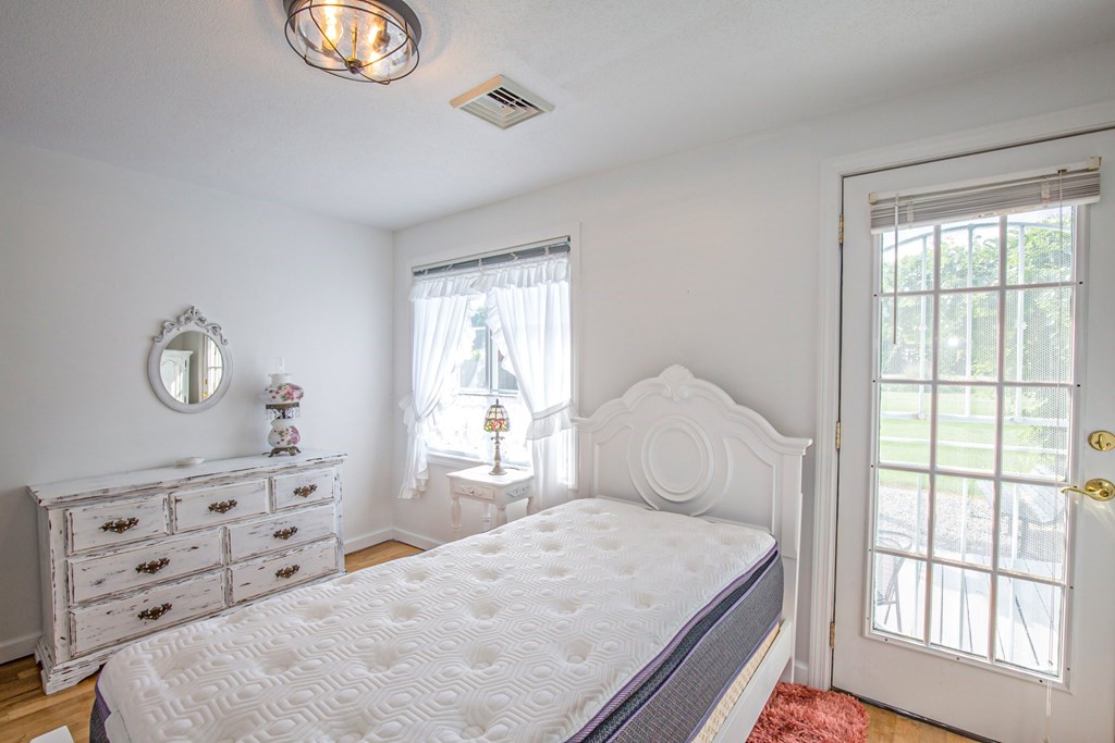 130 Cottage Road Enfield, CT 06082 - Photo 12 of 33 a bedroom with a bed and a window