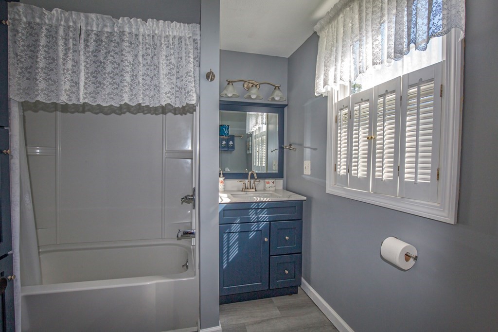130 Cottage Road Enfield, CT 06082 - Photo 14 of 33 a bathroom with a tub sink and mirror