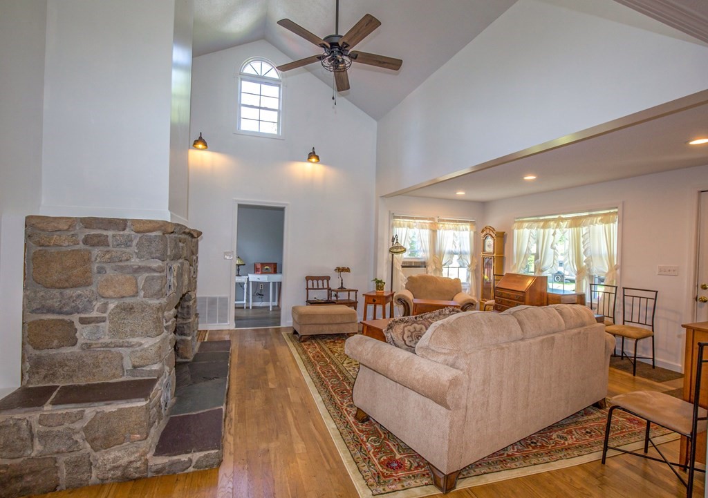 130 Cottage Road Enfield, CT 06082 - Photo 22 of 33 a living room with fireplace furniture and a wooden floor