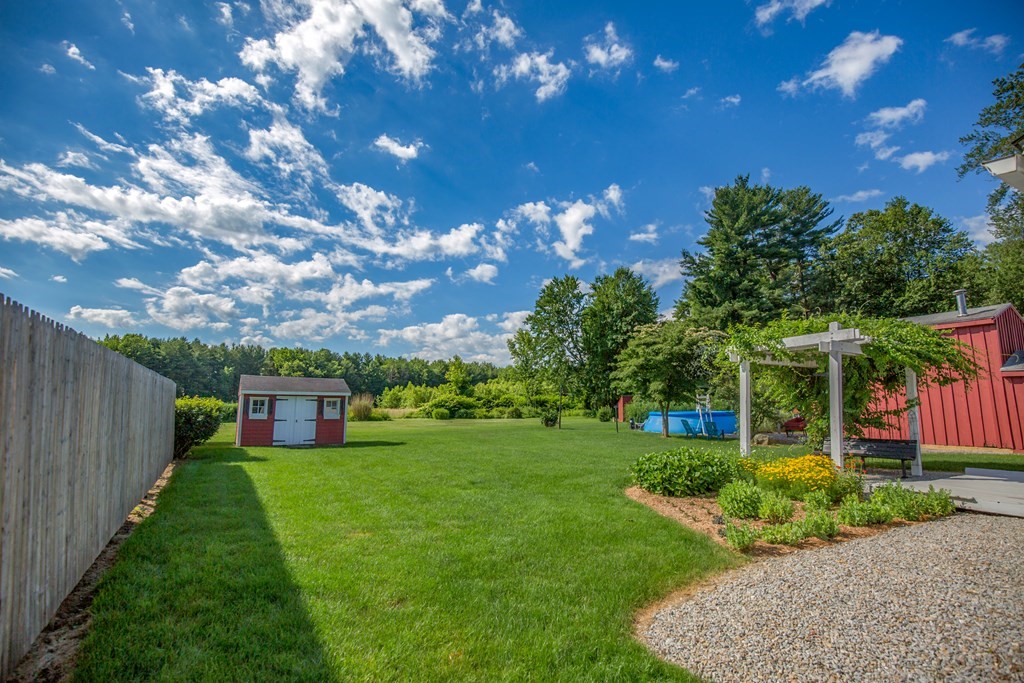 130 Cottage Road Enfield, CT 06082 - Photo 23 of 33 a view of a house with a backyard porch and sitting area
