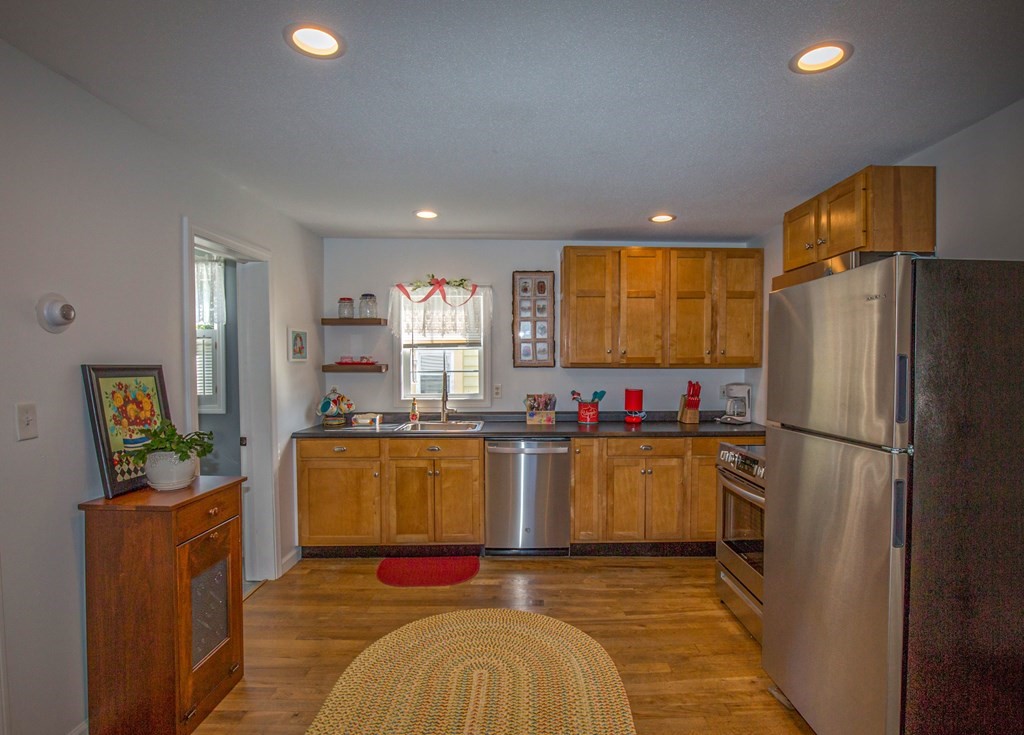 130 Cottage Road Enfield, CT 06082 - Photo 4 of 33 a kitchen with refrigerator and window
