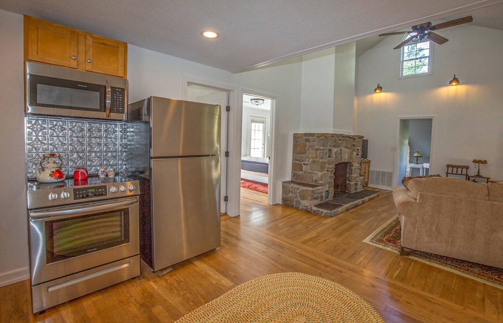 130 Cottage Road Enfield, CT 06082 - Photo 6 of 33 a kitchen with refrigerator and cabinets