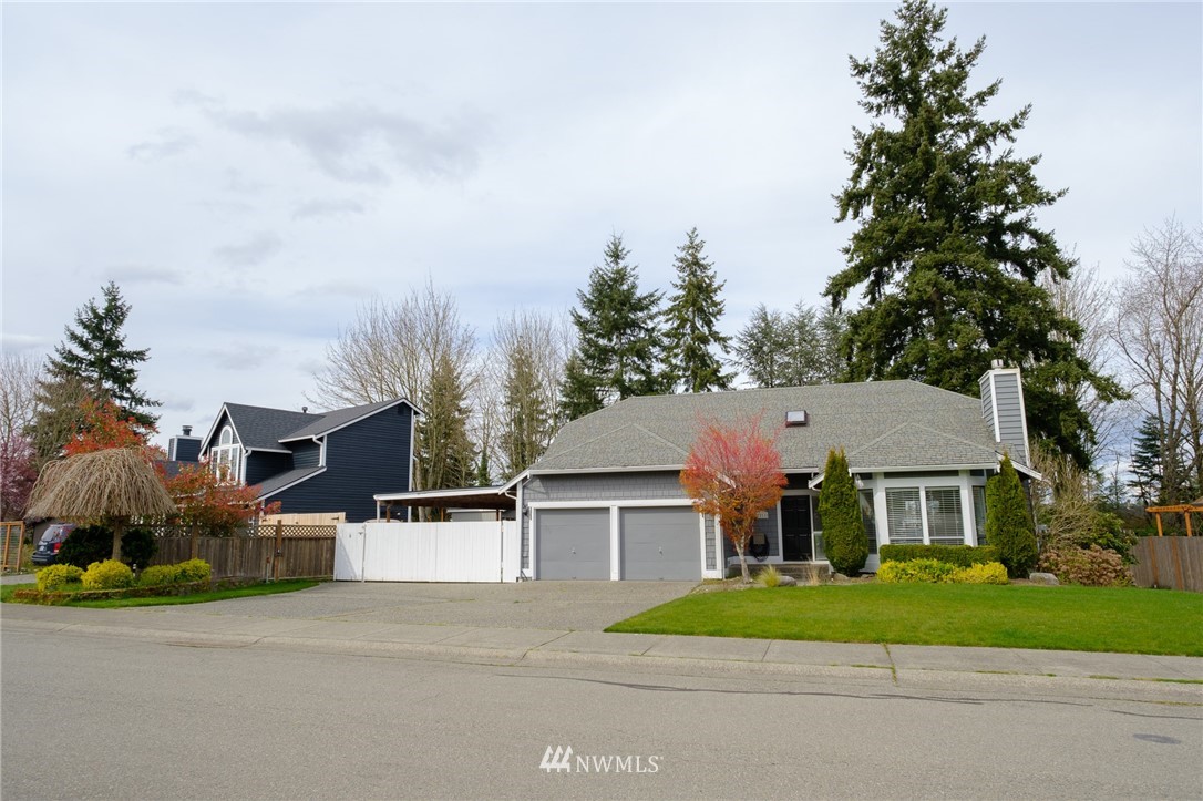 2211 236th Street Southeast Bothell, WA 98021 - Photo 1 of 26 front view of house with a yard