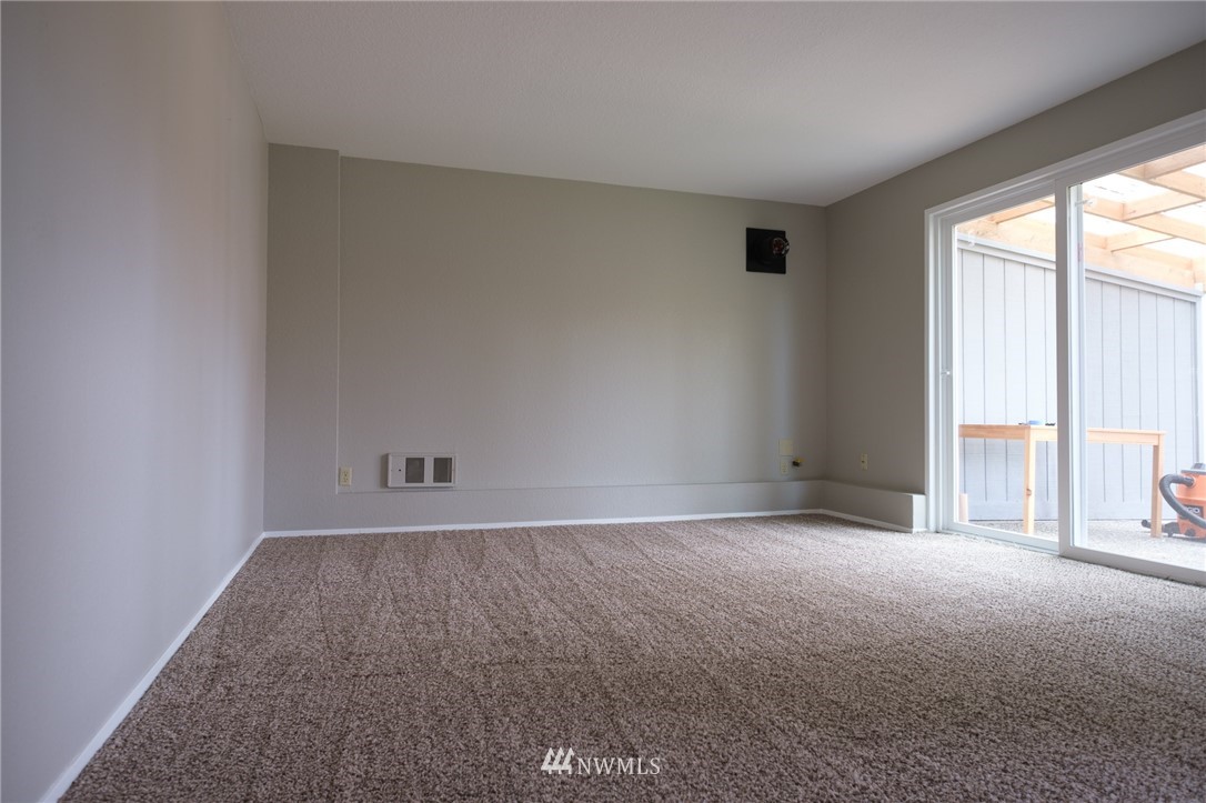 2211 236th Street Southeast Bothell, WA 98021 - Photo 13 of 26 an empty room with windows