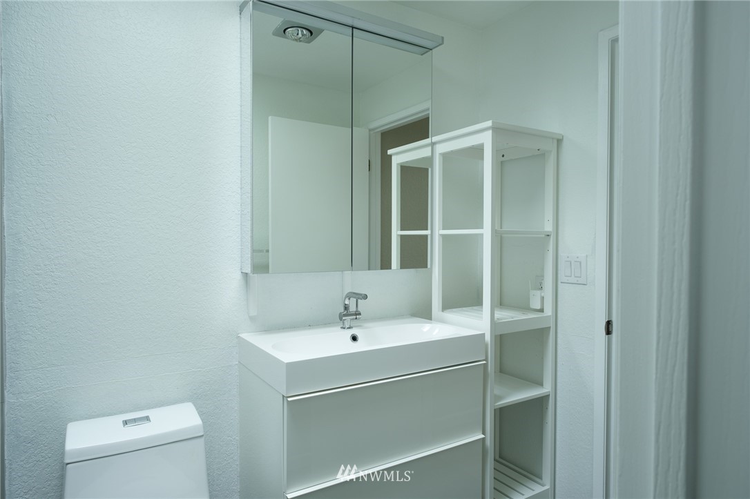 2211 236th Street Southeast Bothell, WA 98021 - Photo 15 of 26 a bathroom with a sink and a toilet