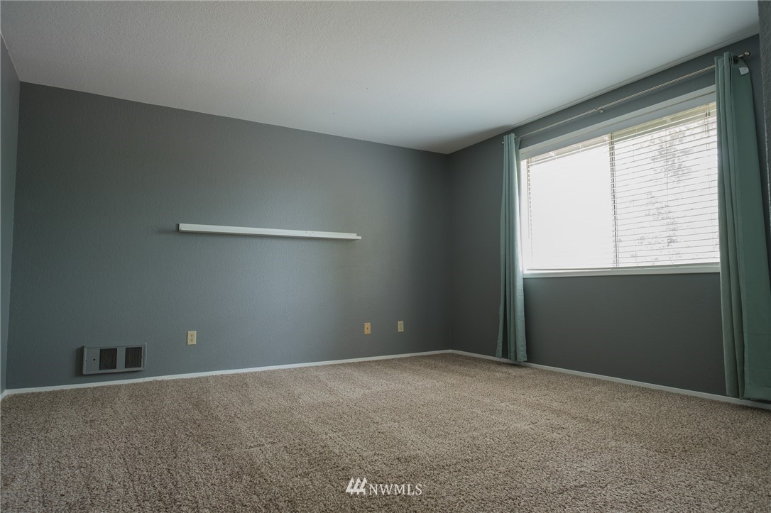 2211 236th Street Southeast Bothell, WA 98021 - Photo 16 of 26 a view of an empty room with a window