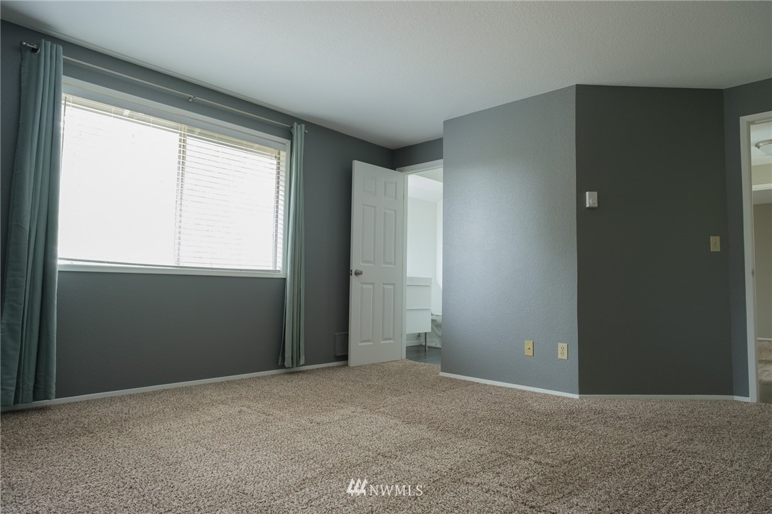 2211 236th Street Southeast Bothell, WA 98021 - Photo 17 of 26 an empty room with windows and closet