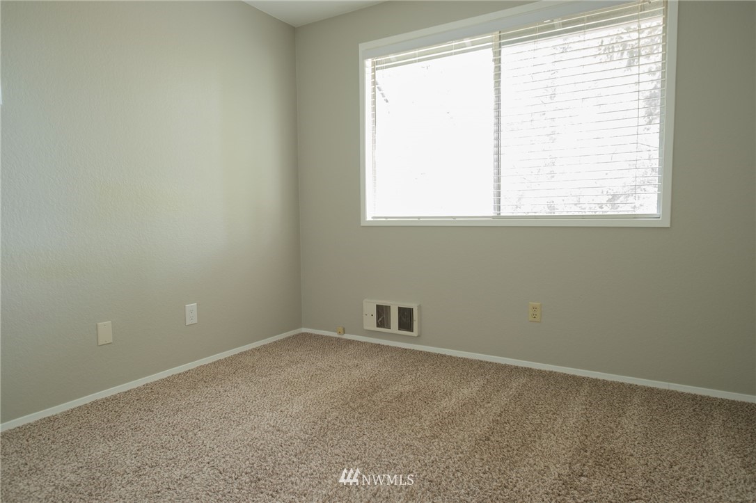 2211 236th Street Southeast Bothell, WA 98021 - Photo 19 of 26 an empty room with a window