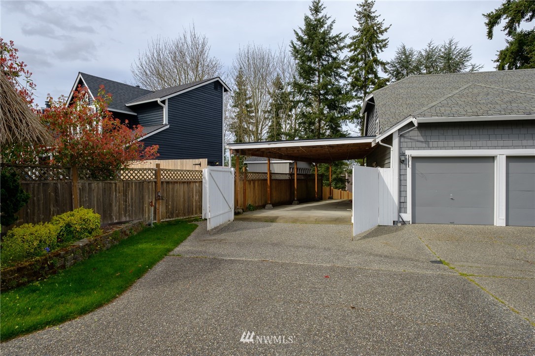 2211 236th Street Southeast Bothell, WA 98021 - Photo 3 of 26 a view of a house with a patio and a yard