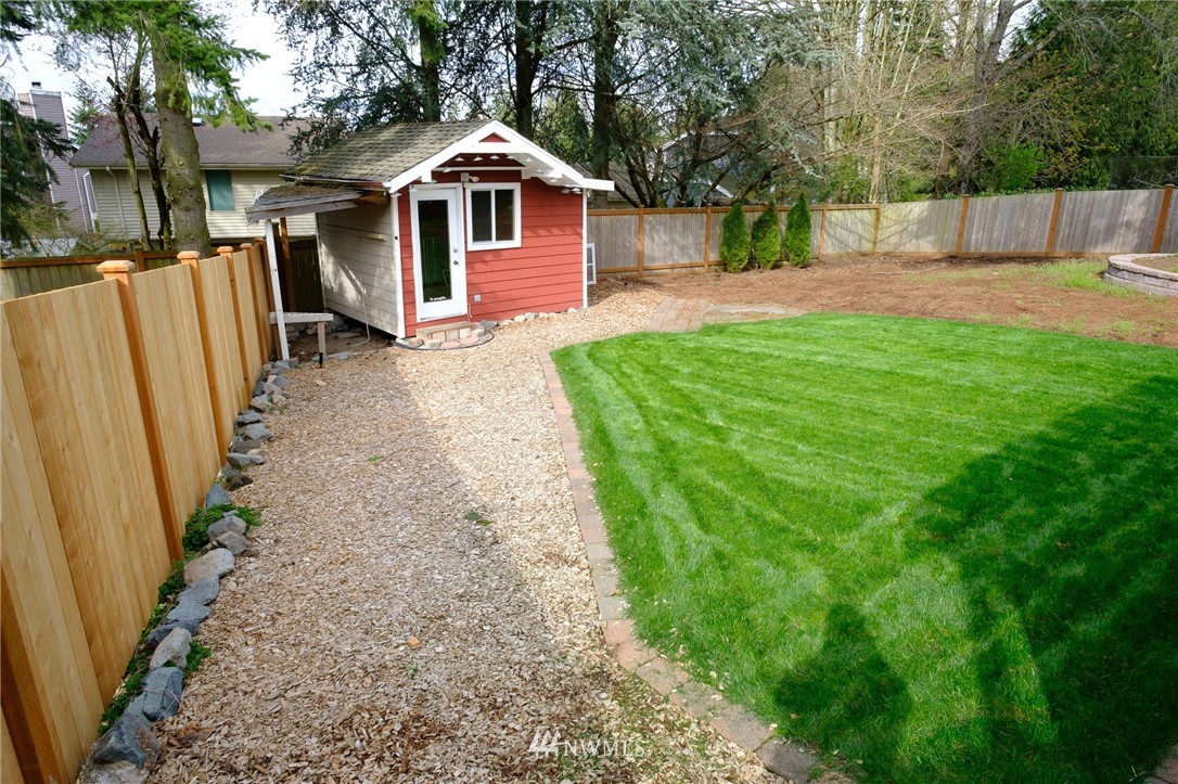 2211 236th Street Southeast Bothell, WA 98021 - Photo 23 of 26 a front view of a house with a yard