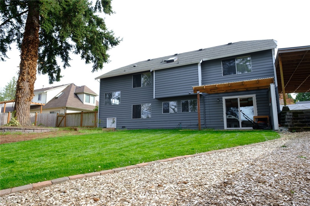 2211 236th Street Southeast Bothell, WA 98021 - Photo 25 of 26 a front view of a house with a garden
