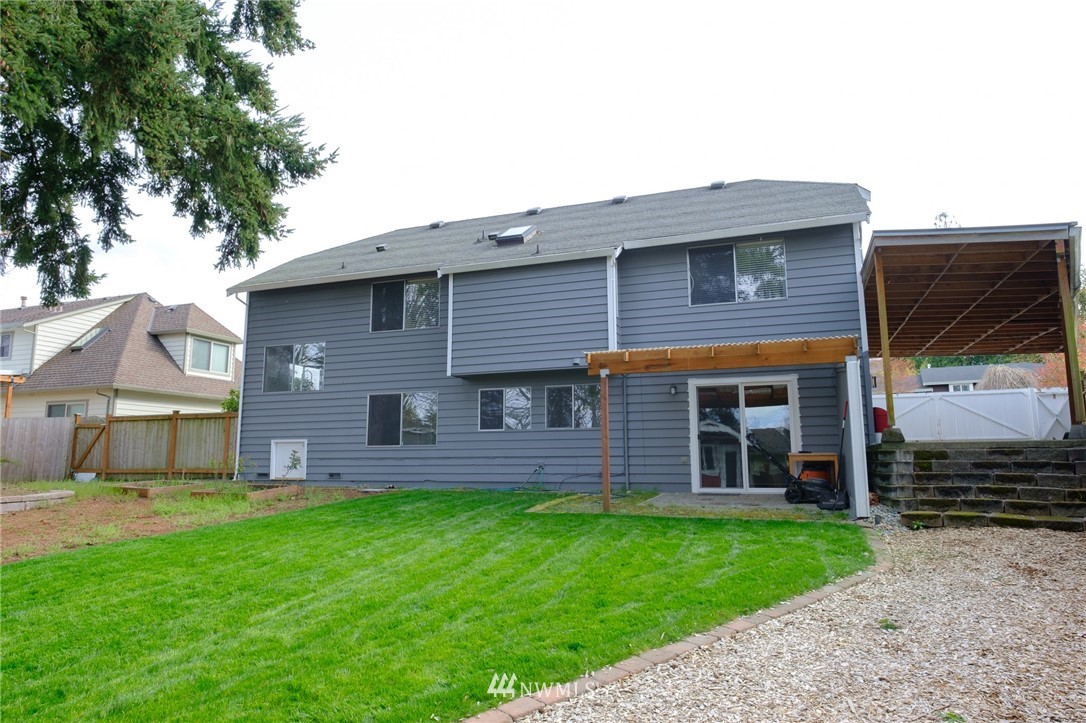 2211 236th Street Southeast Bothell, WA 98021 - Photo 26 of 26 a front view of a house with a garden