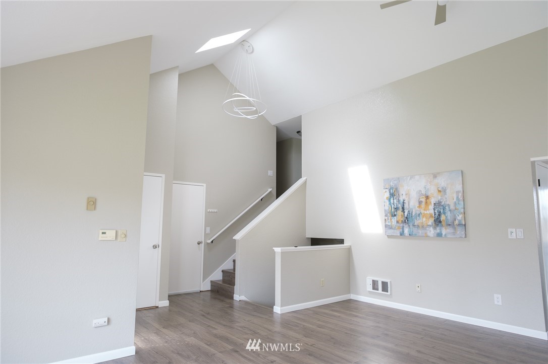 2211 236th Street Southeast Bothell, WA 98021 - Photo 9 of 26 a view of entryway with stairs and wooden floor