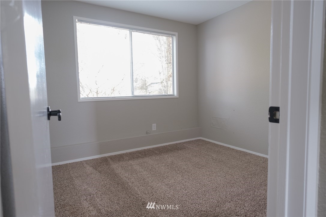 2211 236th Street Southeast Bothell, WA 98021 - Photo 10 of 26 an empty room with a window