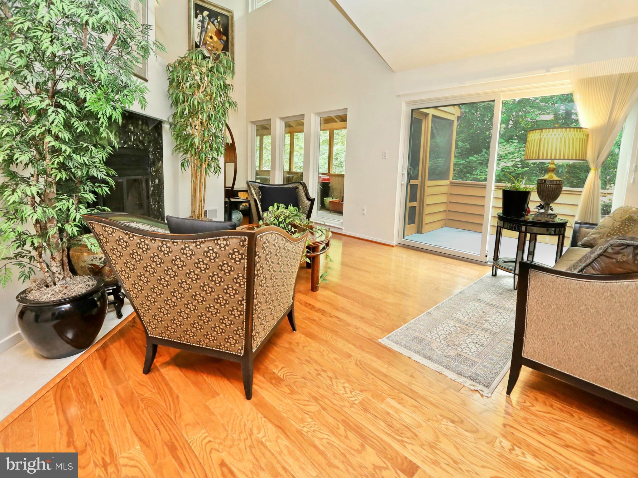 11037 Solaridge Drive Reston, VA 20191 - Photo 7 of 45 Living room with a wood-burning fireplace