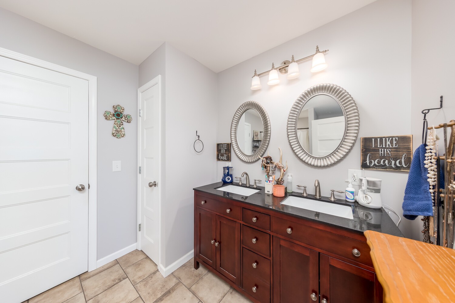 530 Lower Helton Road Alexandria, TN 37012 - Photo 18 of 24 a room with round mirror and cabinets