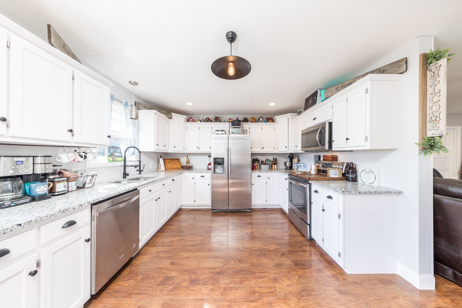 530 Lower Helton Road Alexandria, TN 37012 - Photo 7 of 24 a kitchen with stainless steel appliances and white cabinets