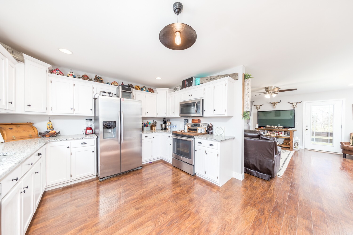 530 Lower Helton Road Alexandria, TN 37012 - Photo 8 of 24 a kitchen with cabinets and wooden floor