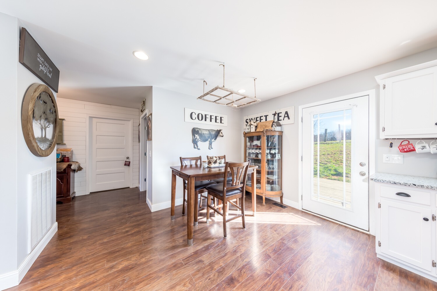 530 Lower Helton Road Alexandria, TN 37012 - Photo 10 of 24 a view of a dining room with furniture window and wooden floor