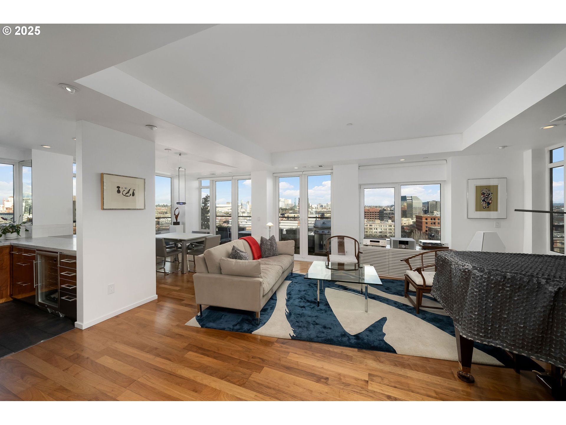300 Northwest 8th Avenue, Unit 902 Portland, OR 97209 - Photo 14 of 46 a living room with furniture a dining table and kitchen view