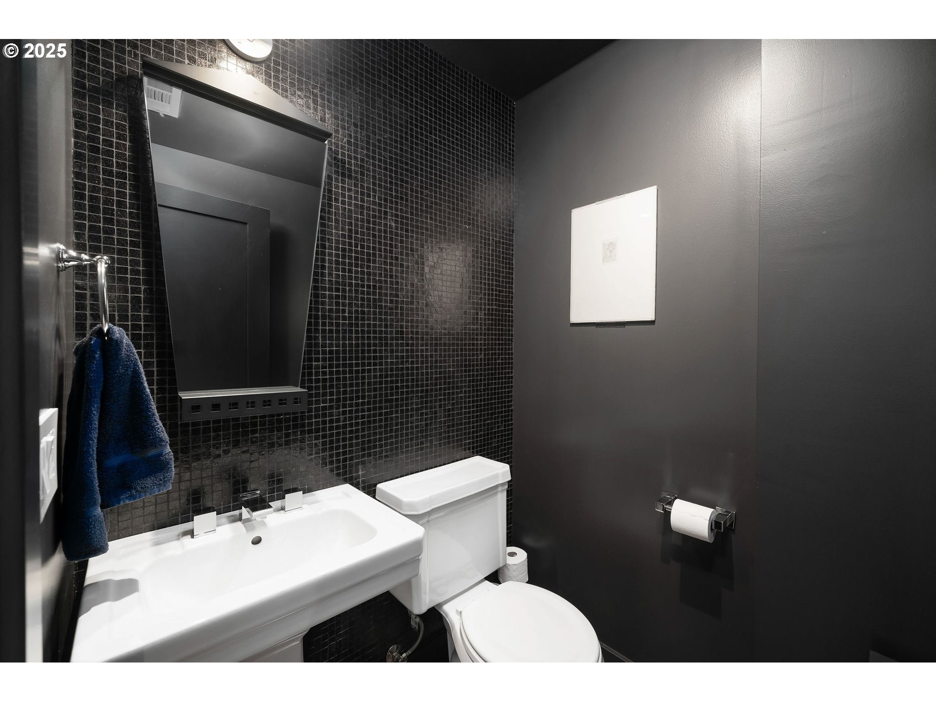 300 Northwest 8th Avenue, Unit 902 Portland, OR 97209 - Photo 21 of 46 a bathroom with a sink toilet and mirror