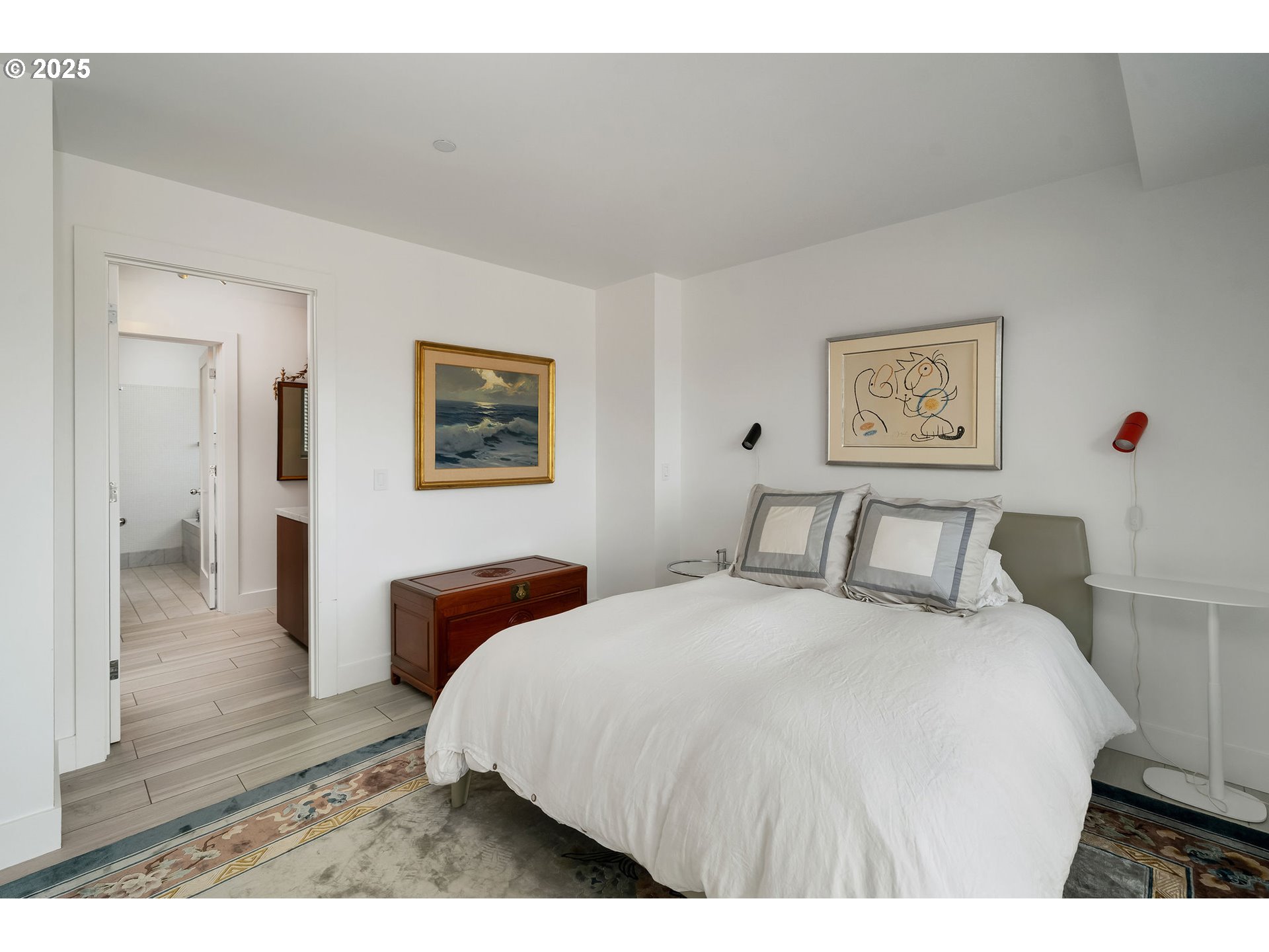 300 Northwest 8th Avenue, Unit 902 Portland, OR 97209 - Photo 24 of 46 a bedroom with a bed and a painting on the wall