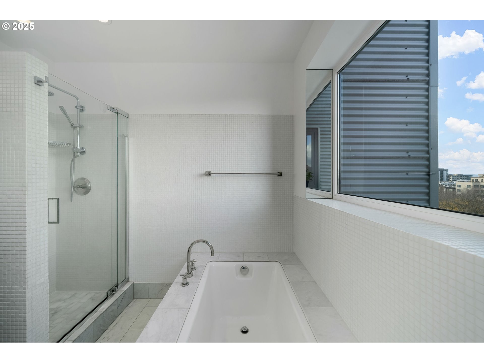 300 Northwest 8th Avenue, Unit 902 Portland, OR 97209 - Photo 29 of 46 a bathroom with a sink a mirror and shower
