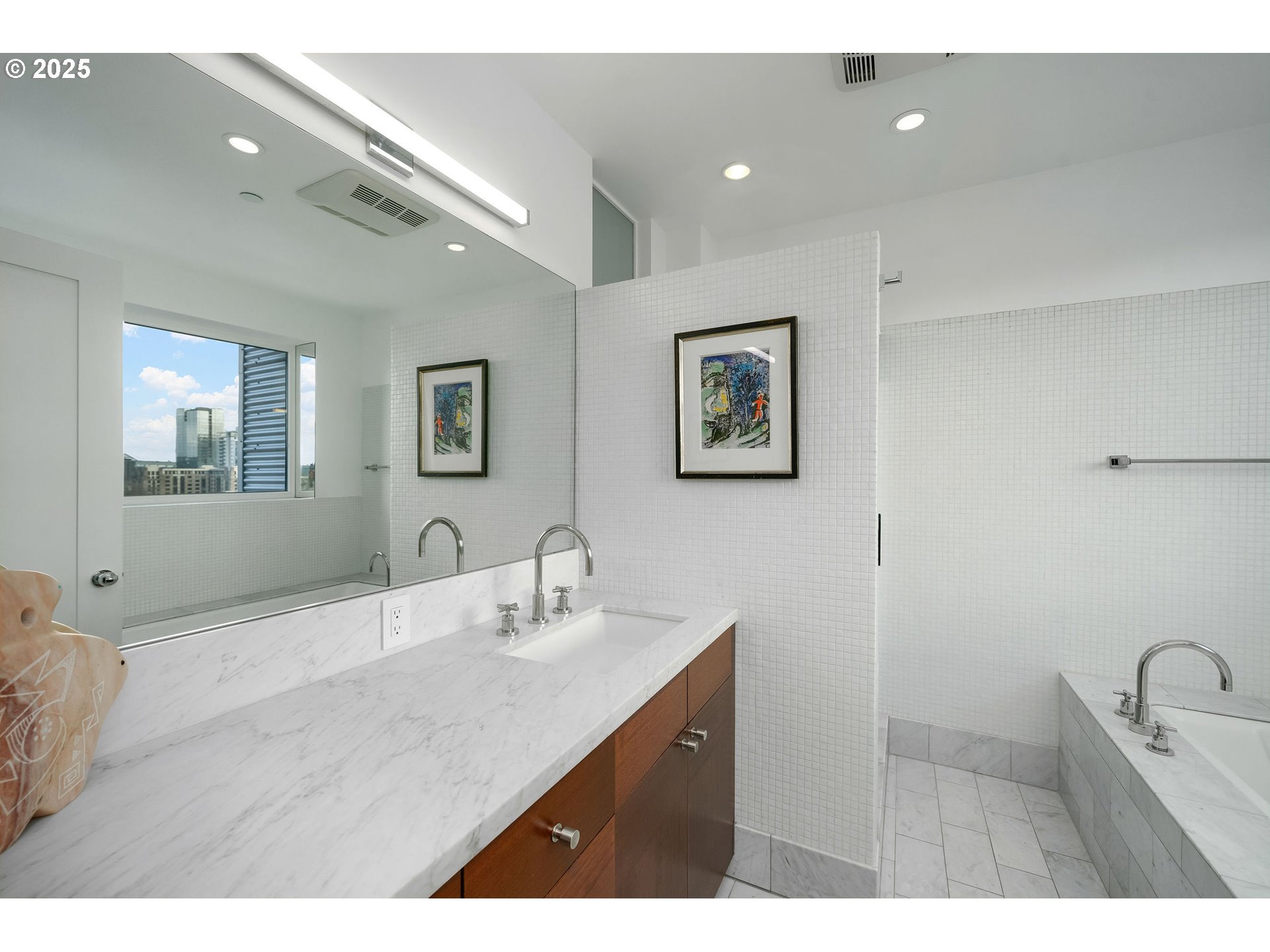 300 Northwest 8th Avenue, Unit 902 Portland, OR 97209 - Photo 30 of 46 a bathroom with a sink double vanity and a mirror