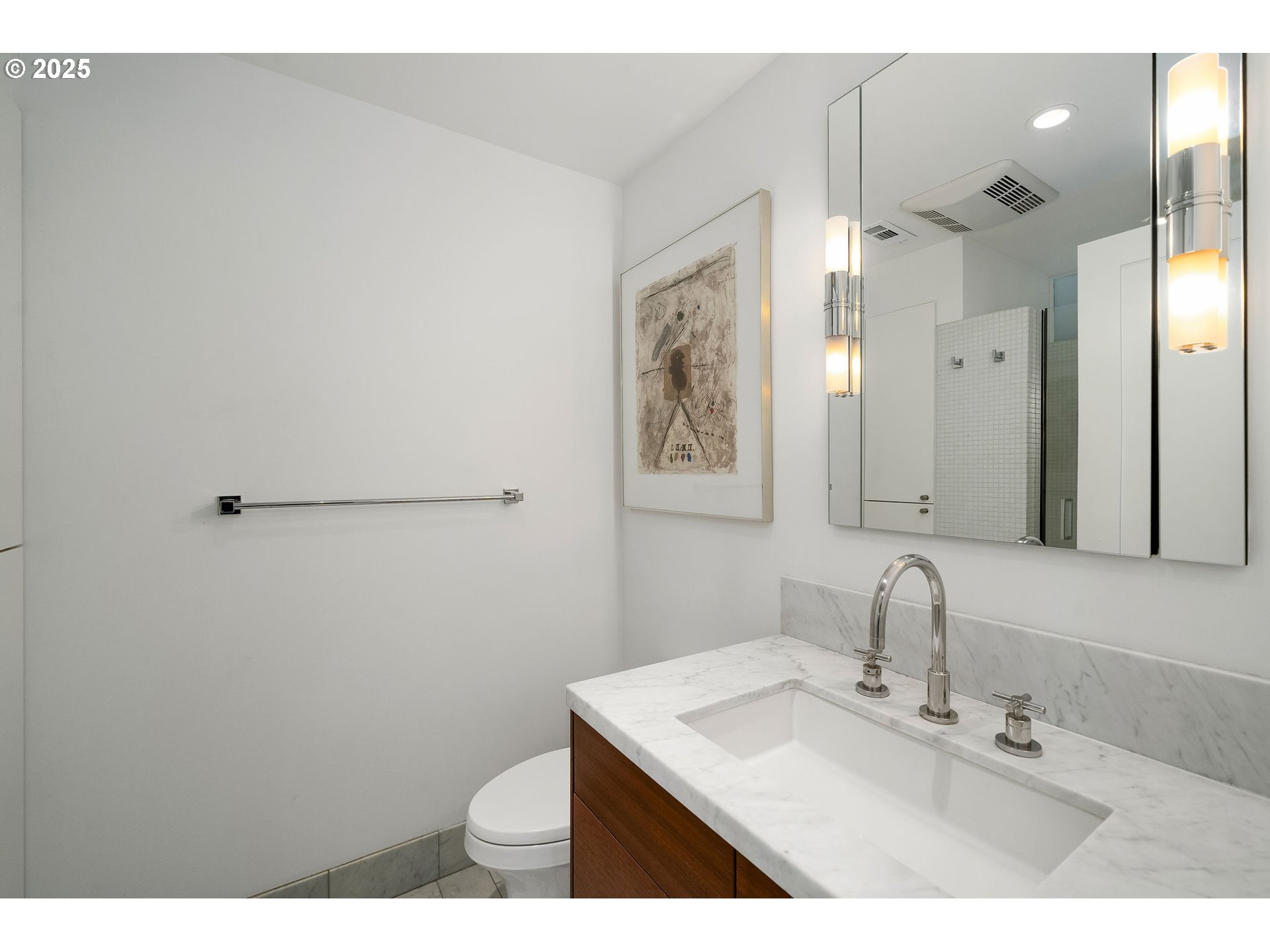 300 Northwest 8th Avenue, Unit 902 Portland, OR 97209 - Photo 32 of 46 a bathroom with a sink mirror and a toilet