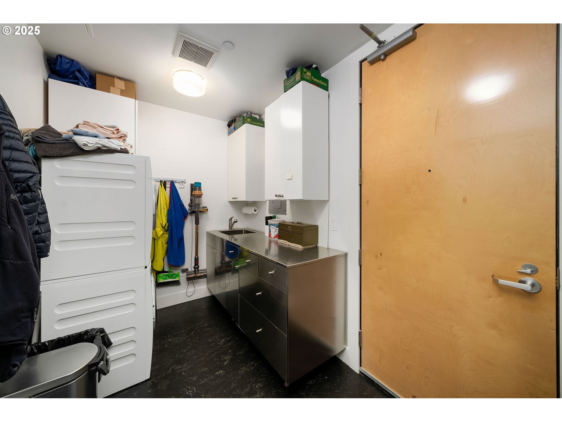 300 Northwest 8th Avenue, Unit 902 Portland, OR 97209 - Photo 35 of 46 a view of walk in closet with clothes and shoes