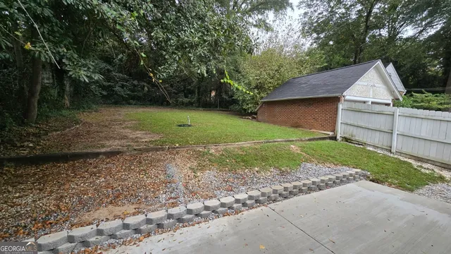 a view of a house with a yard and plants