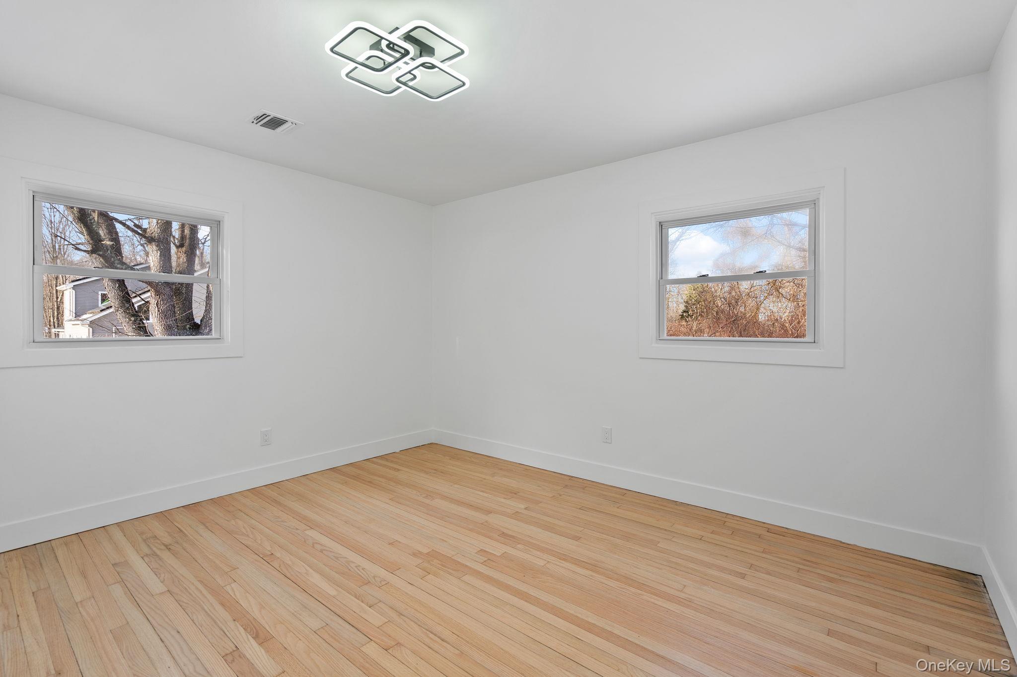 52 Rudolph Road Modena, NY 12548 - Photo 15 of 49 Empty room featuring light wood-style floors and baseboards